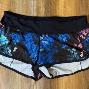 Lululemon speed shorts, black with blue and pink flower pattern - Sz 10